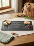 Planche apéro pêche personnalisée avec fromage raisins et crackers
