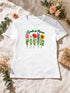 Visuel d’illustration – T-shirt femme blanc avec le design « Le jardin de Maman », posé à plat avec un bouquet, avec les prénoms d’exemple Léa, Tom, Zoé, Jules et Inès